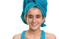 Teen girl with a blue towel wrapped over her wet hair Royalty Free Stock Photo