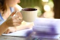 Teen girl with book hold tea cup close up photo