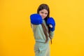 teen girl in boxing goves. boxing training of teen girl. girl learn punching. teen defense. girl sport training. sport