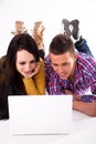 Teen girl and boy with white laptop Royalty Free Stock Photo