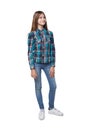 Teen girl in checkered shirt standing casually