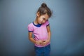 Teen girl child stomach ache on gray background