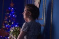 Teen girl in Christmas at the beautiful Christmas tree g Royalty Free Stock Photo