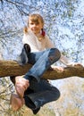 Teen girl climbing on the tree Royalty Free Stock Photo