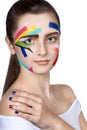 Teen girl with colored stripes on the face. Bright make-up art. Royalty Free Stock Photo