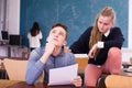 Teen girl comforting sad coursemate