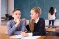 Teen girl comforting sad coursemate