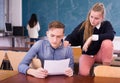 Teen girl comforting sad coursemate