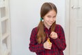 Teen girl cutting hair to herself with scissors Royalty Free Stock Photo