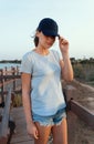 Teen girl in dark blue baseball cap and t-shirt Royalty Free Stock Photo