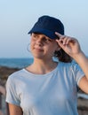 Teen girl in dark blue baseball cap and t-shirt Royalty Free Stock Photo