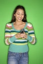 Teen girl dialing cellphone. Royalty Free Stock Photo