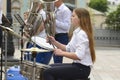 Teen girl drummer playing drums. Festival of brass orchestras. Kyiv, Ukraine