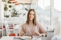 Teen girl eating dessert in cafe Royalty Free Stock Photo