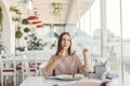 Teen girl eating dessert in cafe Royalty Free Stock Photo