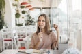 Teen girl eating dessert in cafe Royalty Free Stock Photo