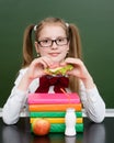 Teen girl eating a sandwich at lunchtime