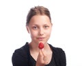 Teen girl eating strawberry Royalty Free Stock Photo