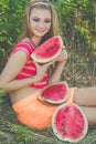 Teen girl is eating watermelon in green park Royalty Free Stock Photo