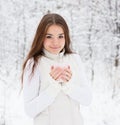 Teen girl enjoying big mug of hot drink during cold day Royalty Free Stock Photo