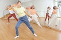 Teen girl with family doing aerobics exercises with group of people in dance center Royalty Free Stock Photo