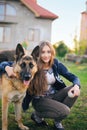 The teen girl finds solace in communicating with her friend a dog by a German shepherd