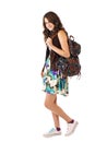 Teen girl in flowered dress and backpack