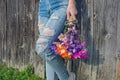 Teen girl with frayed jeans and daisies Royalty Free Stock Photo