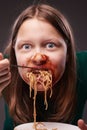 Teen girl furiously eating Royalty Free Stock Photo