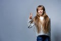 Teen girl gesturing V sign Royalty Free Stock Photo