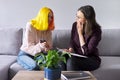 Teen girl giving interview to social worker. School psychologist talking with student Royalty Free Stock Photo