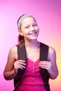 Teen girl goes to school with a backpack on her back Royalty Free Stock Photo