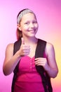 Teen girl goes to school with a backpack on her back Royalty Free Stock Photo