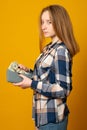 Sad teen girl with gray wallet full of money dollars Royalty Free Stock Photo