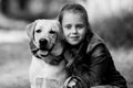 Teen girl with her dog. Black and white photo. Royalty Free Stock Photo