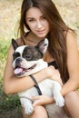 Teen girl with her french bulldog puppy