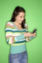 Teen girl holding cell phone. Royalty Free Stock Photo