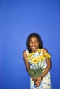 Teen girl holding flowers. Royalty Free Stock Photo