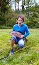 Girl holding large rainbow trout with huge smile Royalty Free Stock Photo