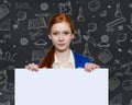 Teen girl holding a sign with copyspace for adverts