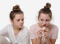 Teen girl holds sweet cream cake in her hand and wants to eat, white background