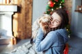 Teen girl hugging a dog. The concept of Christmas Royalty Free Stock Photo