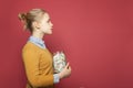 Teen girl with jar full of money cash. Students fees, responsibility and saving money concept