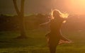 Teen girl jump against beautiful sunset Royalty Free Stock Photo