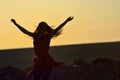 Teen girl jump against beautiful sunset Royalty Free Stock Photo