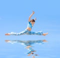 Teen Girl jump on blue background