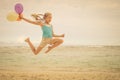 Teen girl jumping on the beach Royalty Free Stock Photo