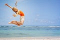 Teen girl jumping on the beach Royalty Free Stock Photo