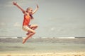 Teen girl jumping on the beach Royalty Free Stock Photo