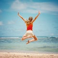 Teen girl jumping on the beach Royalty Free Stock Photo